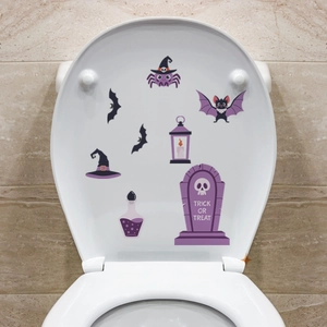 Halloween toilet seat decal set with spiders, bats, and tombstones for bathroom decor