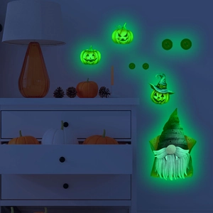 Luminous Halloween wall stickers featuring green glowing gnomes and pumpkins on a white cabinet