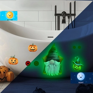 Glow-in-the-dark Halloween wall stickers showing daytime look vs green night luminescence