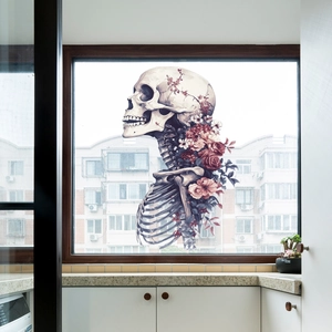 Gothic skull window sticker with red roses and pink flowers on glass surface