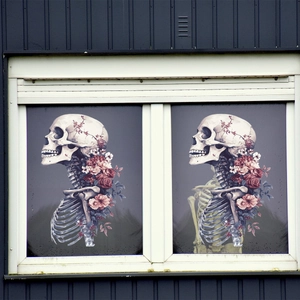Detail of gothic skull and pink rose double-sided static window stickers on glass