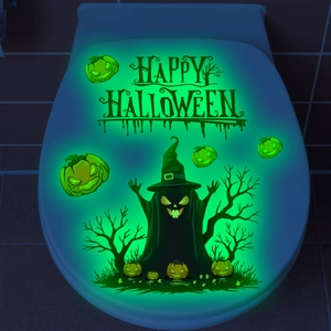 Luminous Halloween wall stickers featuring glowing ghosts and pumpkins on a toilet lid