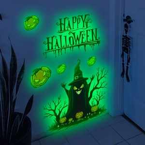 Luminous Halloween wall stickers set with glowing ghosts and pumpkins in a dark room decor