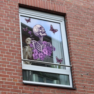 Detailed static window clings with skull, purple flowers and butterflies for Halloween decor