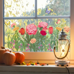 Detail of floral and butterfly window clings with double-sided design on clear glass