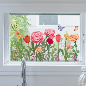 Detail showing colorful hand-painted flower and butterfly window stickers on glass surface