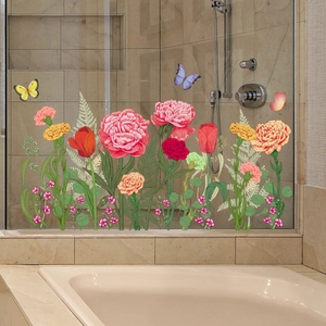 Detail of floral and butterfly window stickers on a glass bathroom door surface