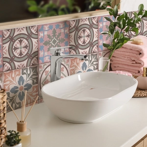 Detailed view of vintage Moroccan tile stickers with floral patterns on a bathroom wall