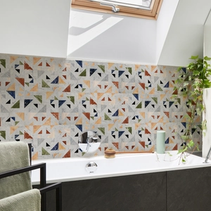 Detail of geometric tile stickers with marble texture on a modern bathroom wall