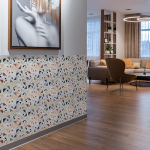 Detail view of geometric mosaic wall tile stickers in a modern hallway interior