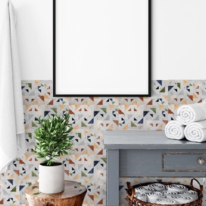 Detail of colorful geometric marble tile stickers in a modern bathroom setting
