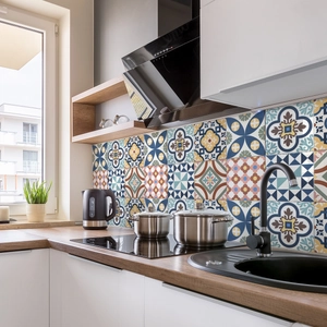 Detail of vintage bohemian tile stickers with mandala patterns on kitchen backsplash