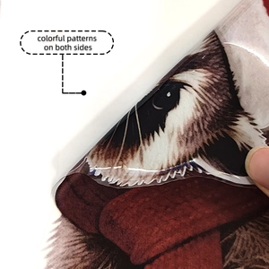 Close-up showing the double-sided printing of the Christmas raccoon static window sticker
