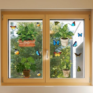 Close-up of butterfly and potted plant window stickers on transparent glass