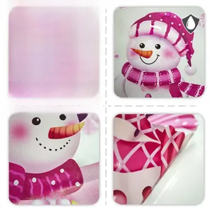 Detail showing waterproof snowmen window stickers with double-sided pink scarf pattern