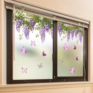 Detailed indoor view showing purple wisteria and butterfly static cling window stickers