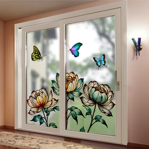 Detail of vibrant butterfly and vintage flower stained glass window film on sliding doors