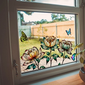 Detail of floral window decals with vibrant peonies and butterflies on glass