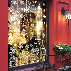 White Christmas window static clings featuring festive houses and snowflakes on glass
