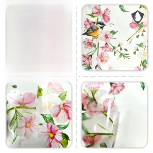 Detail view of pink flowers and bird wall decal showing waterproof texture and peeling state