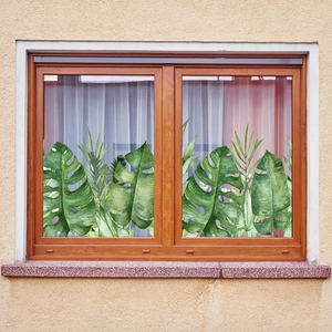 Tropical green plant window film with watercolor monstera leaves and static cling design
