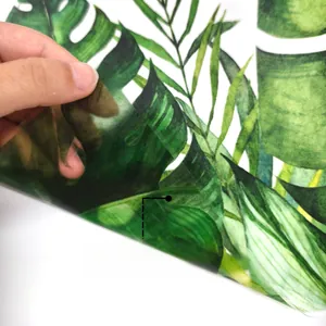 Detail showing double-sided colorful green tropical leaf static cling window sticker film