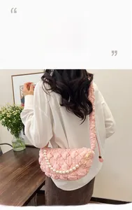 Pink quilted cloud bag featuring a pearl chain and soft ruched shoulder strap detail