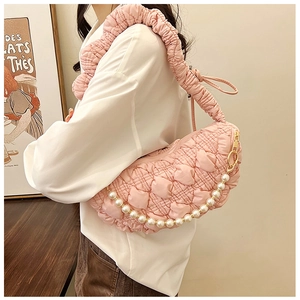 Detail of soft quilted cloud bag featuring puff fabric and elegant pearl chain strap