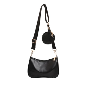 Fashionable black half-moon crossbody bag with detachable round coin purse and gold hardware