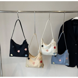 Canvas hobo bag with colorful heart patches and matching small pouch in four colors
