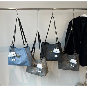 Minimalist canvas tote bag with heart charm in blue-grey and charcoal grey colors