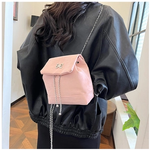 Pink mini PU leather backpack featuring a silver butterfly clasp and elegant chain straps