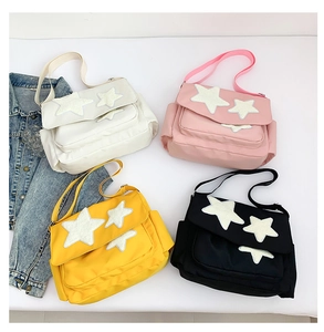 Top view of multi-color canvas star tote bags with wide straps and side pockets