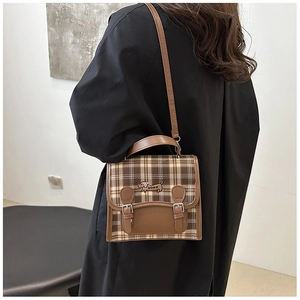 Detailed embroidery of a cartoon dachshund on a retro plaid pattern crossbody bag