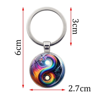 Silver dragon yin yang tai chi keychain with dimensions 6cm length and 2.7cm pendant