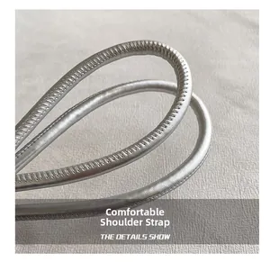 Macro shot of comfortable silver tubular shoulder strap with fine stitching details