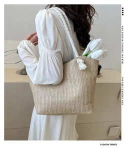 French minimalist straw woven tote bag with thick white rope handles and tulip detail