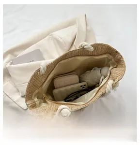 Top view of woven straw tote bag showing spacious interior with zipper and lining