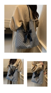 Polka dot canvas tote bag with large satin bow and silver butterfly charm detail