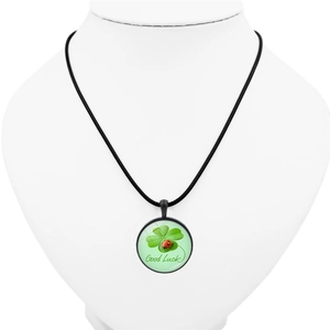 Green four-leaf clover Good Luck pendant necklace with a red ladybug on white mannequin