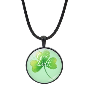 Green four-leaf clover pendant necklace with Good Luck text on a black woven cord