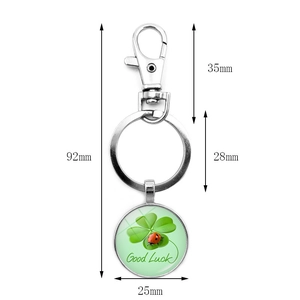 Green four-leaf clover good luck keychain with red ladybug and lobster clasp