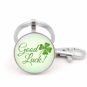 Silver metal keychain with green four-leaf clover and Good Luck glass pendant charm