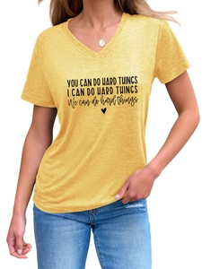 Detail of yellow V-neck t-shirt with You Can Do Hard Things slogan and heart print