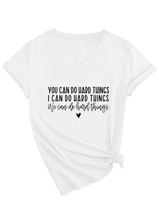 Detail of white V-neck T-shirt showing slogan print and stylish front knot hem design