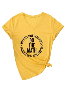 Detail of yellow V-neck T-shirt with rolled sleeves, front slogan print and knotted hem