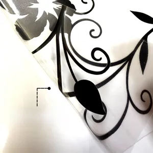 Detail of double-sided black floral vine static cling sticker for glass windows