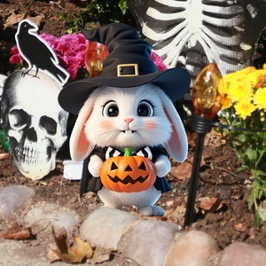 Garden stake detail featuring a white bunny with a wizard hat and pumpkin for Halloween decoration