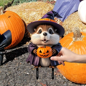 Detail of chipmunk in wizard hat with pumpkin lantern Halloween garden stake sign