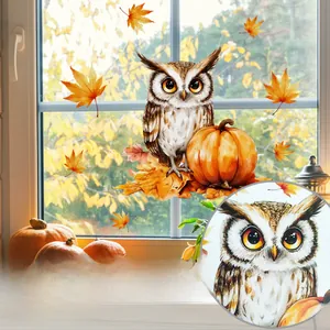 Detail of owl and pumpkin static window stickers with autumn maple leaf patterns